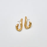 Pair of vintage JS abstract sculptural earrings in gold-tone metal with modern curved design