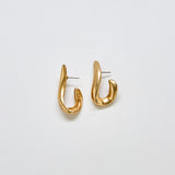 Pair of vintage JS abstract sculptural earrings in gold-tone metal with modern curved design