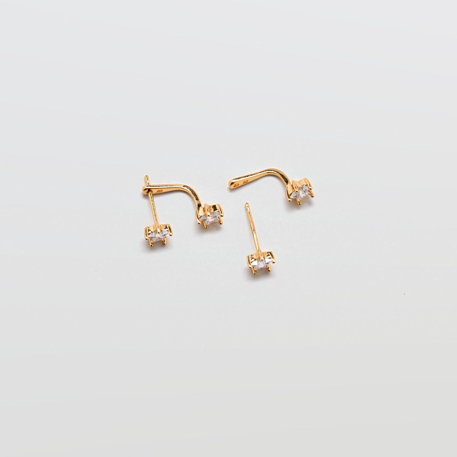 Gold Double CZ Stud Ear Jacket Earrings showing removable cubic zirconia stud and curved ear jacket backing.