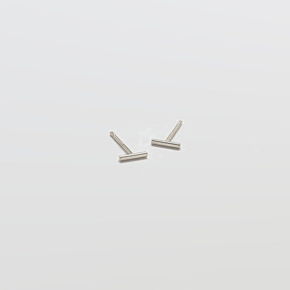 Pair of silver U-shaped earrings on a white background