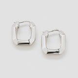 Pair of silver hoop earrings on a light gray background