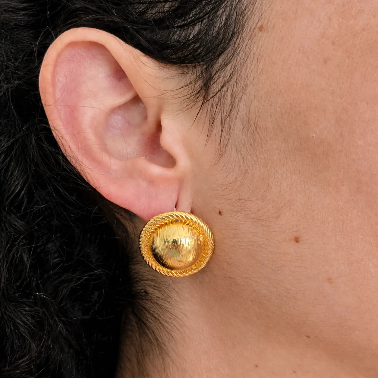 Model wearing Vintage gold rope-trim dome stud earring, close-up