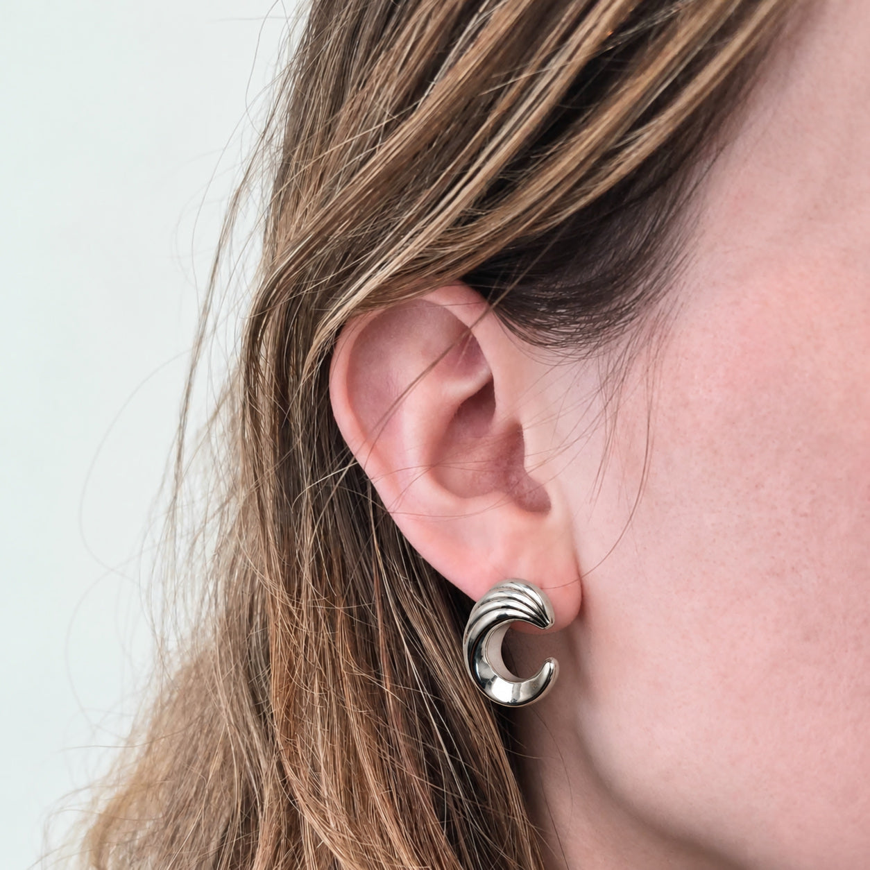 Vintage Silver Ridged Crescent Hoop Earrings — on-model alternate, selective retouch v7