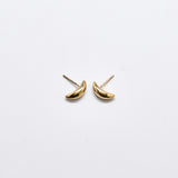 Pair of small curved gold stud earrings with a smooth polished finish and post backs against a white background
