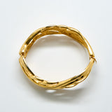 Gold bracelet on a white background