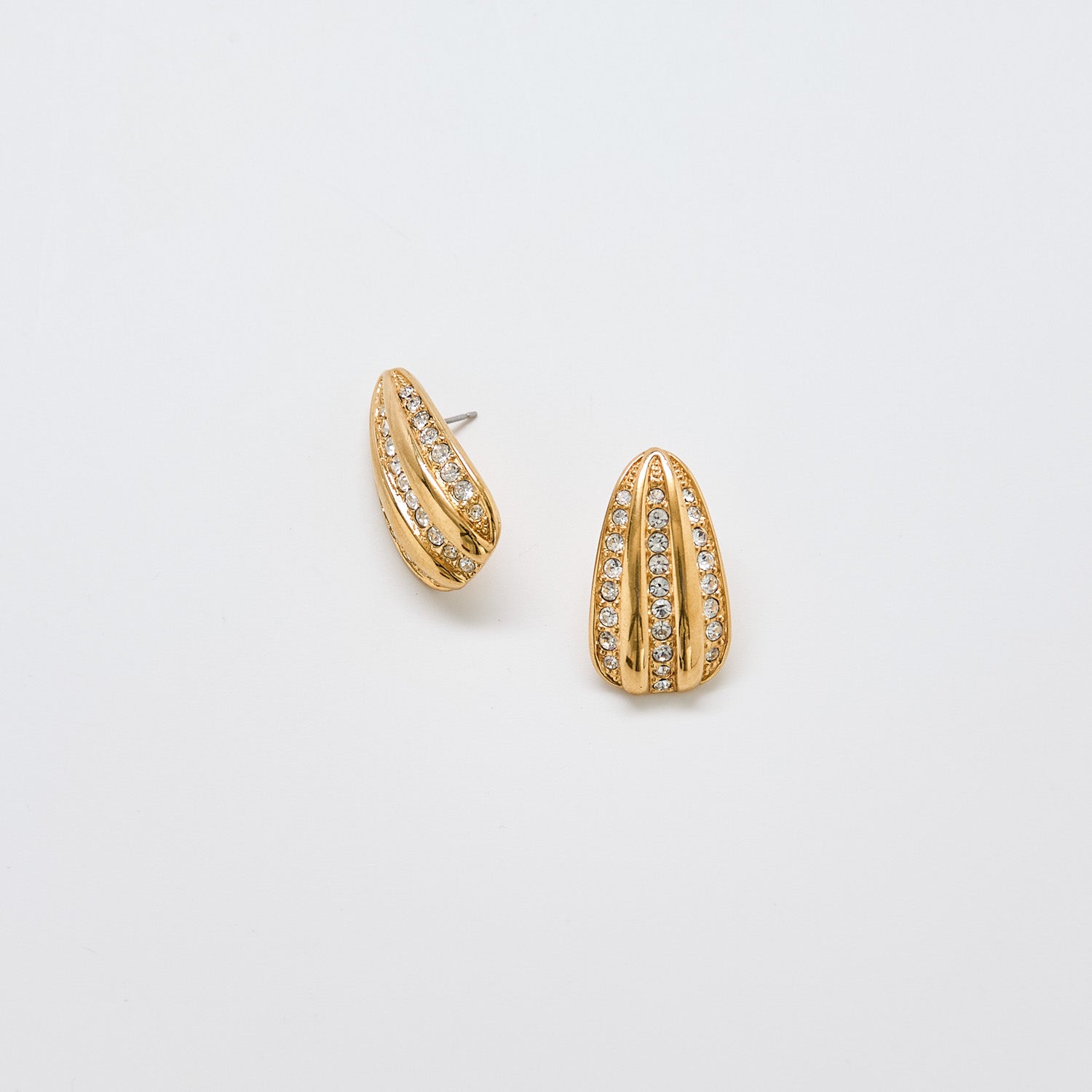 Front view of vintage JS gold-tone tapered earrings featuring vertical rows of rhinestones and sculptural design.