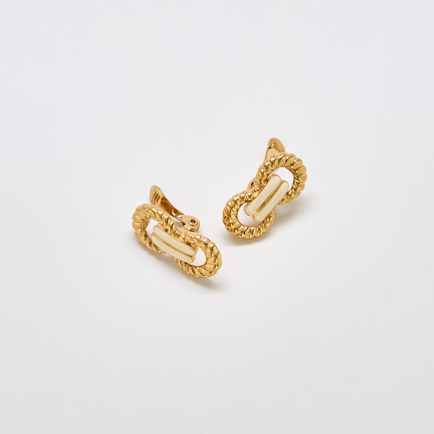 Pair of vintage Monet gold and ivory enamel earrings with interlocking rope-textured links