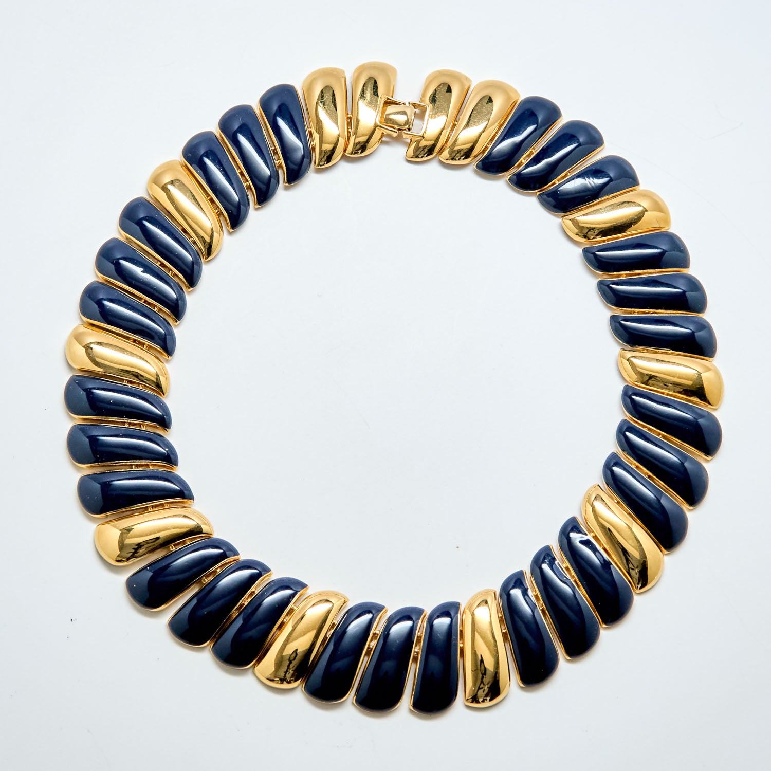 Necklace with blue and gold beads on a white background