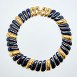 Necklace with blue and gold beads on a white background