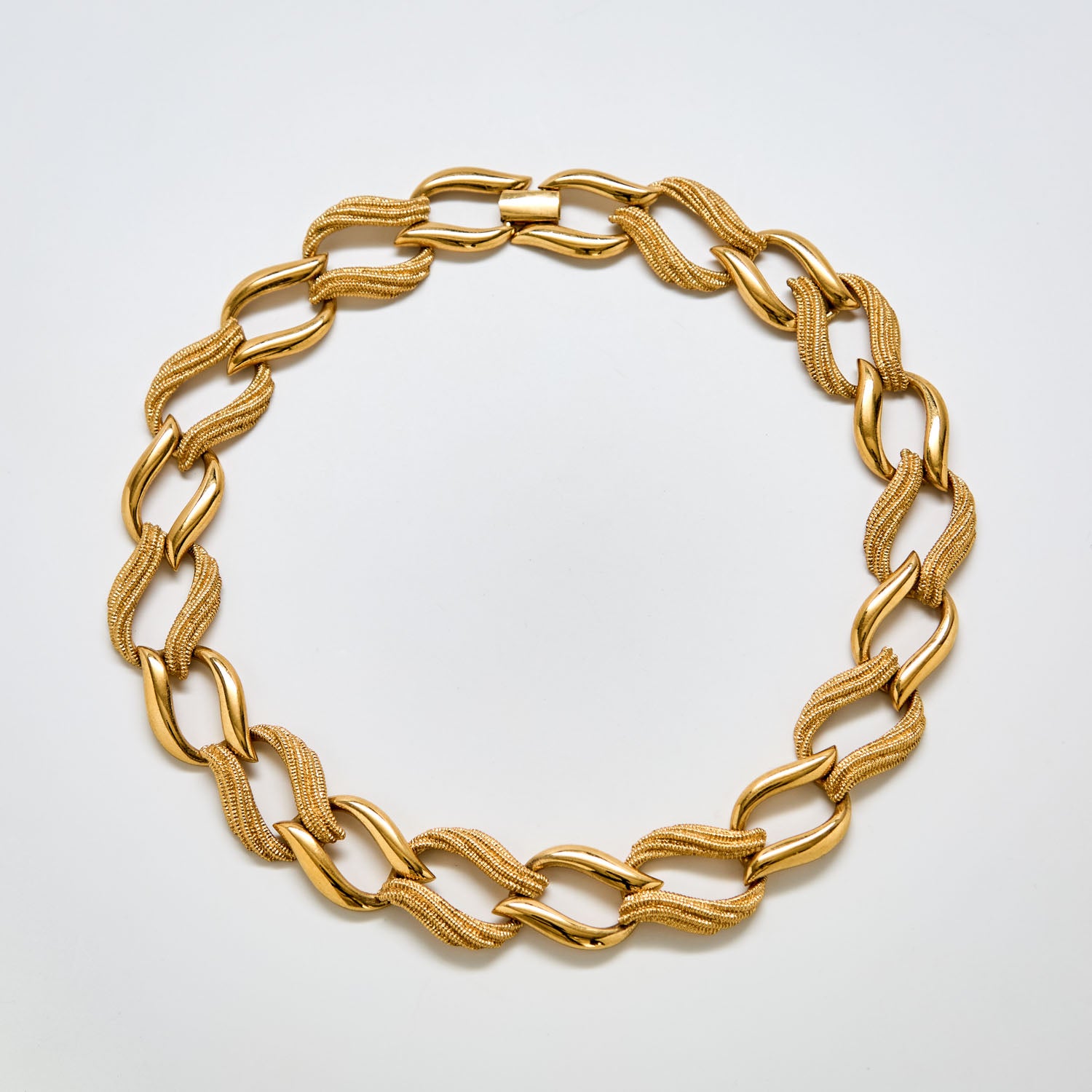Full view of vintage Napier gold textured link necklace featuring alternating polished and mesh-style links