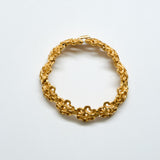 Gold bracelet on a white background