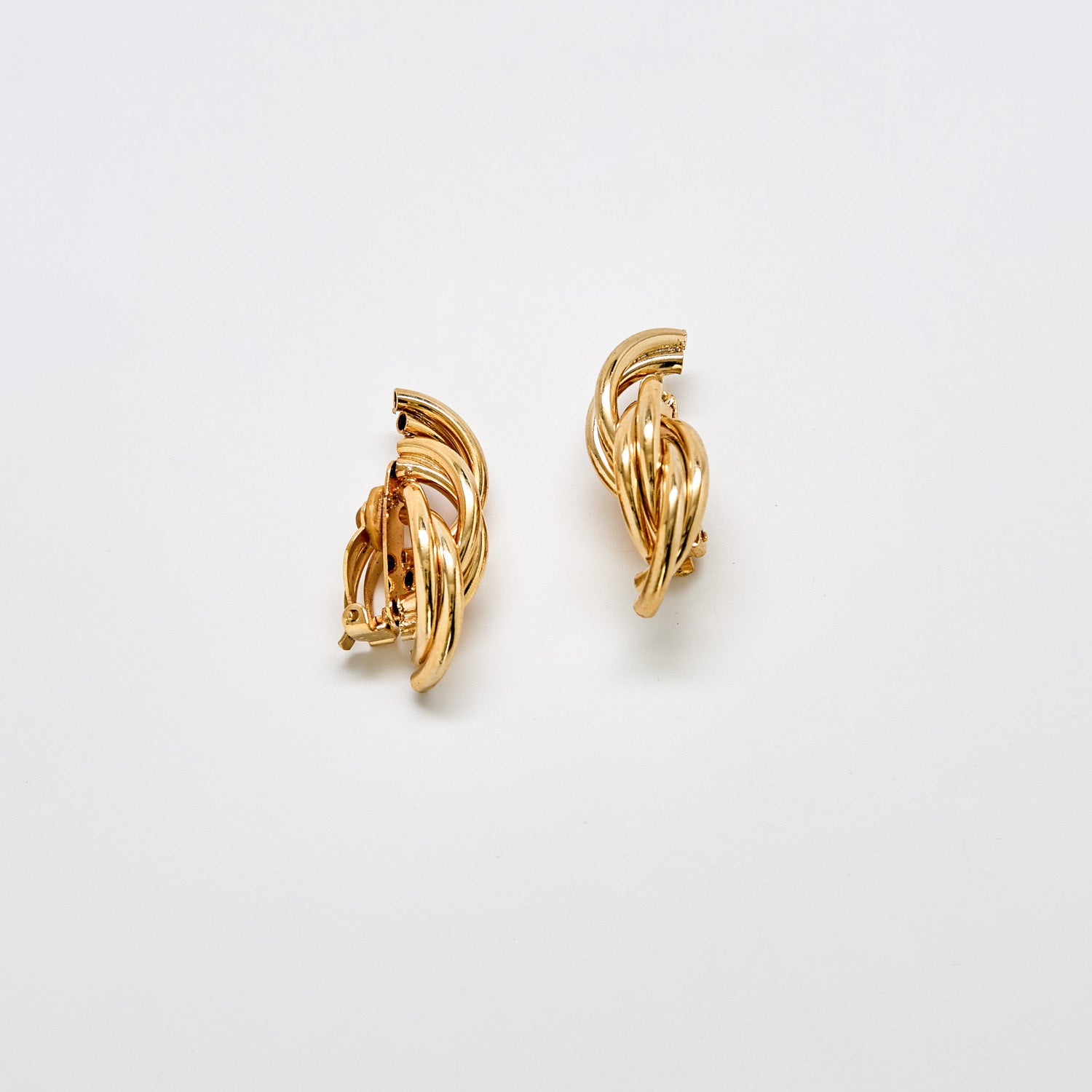 Pair of vintage gold-tone twisted hoop earrings with interwoven sculptural design