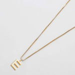 Gold initial necklace with letter E pendant