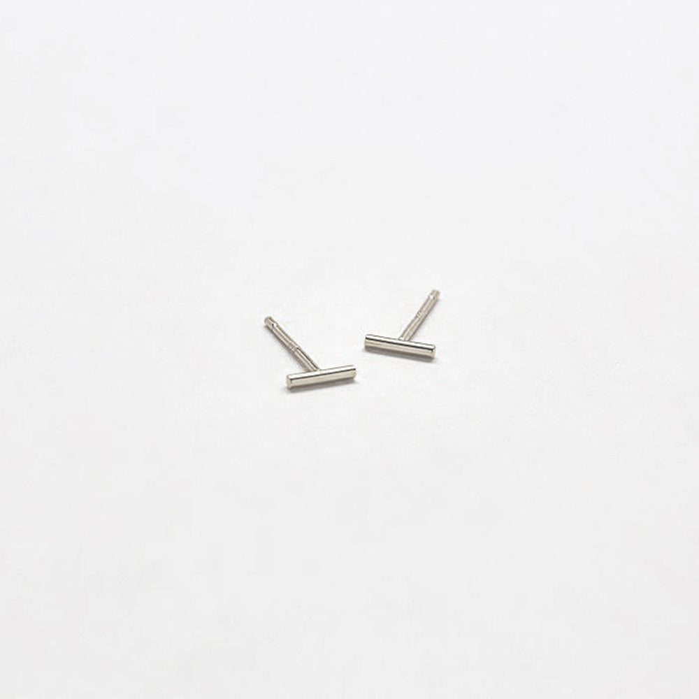 Pair of silver U-shaped earrings on a white background