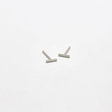 Pair of silver U-shaped earrings on a white background