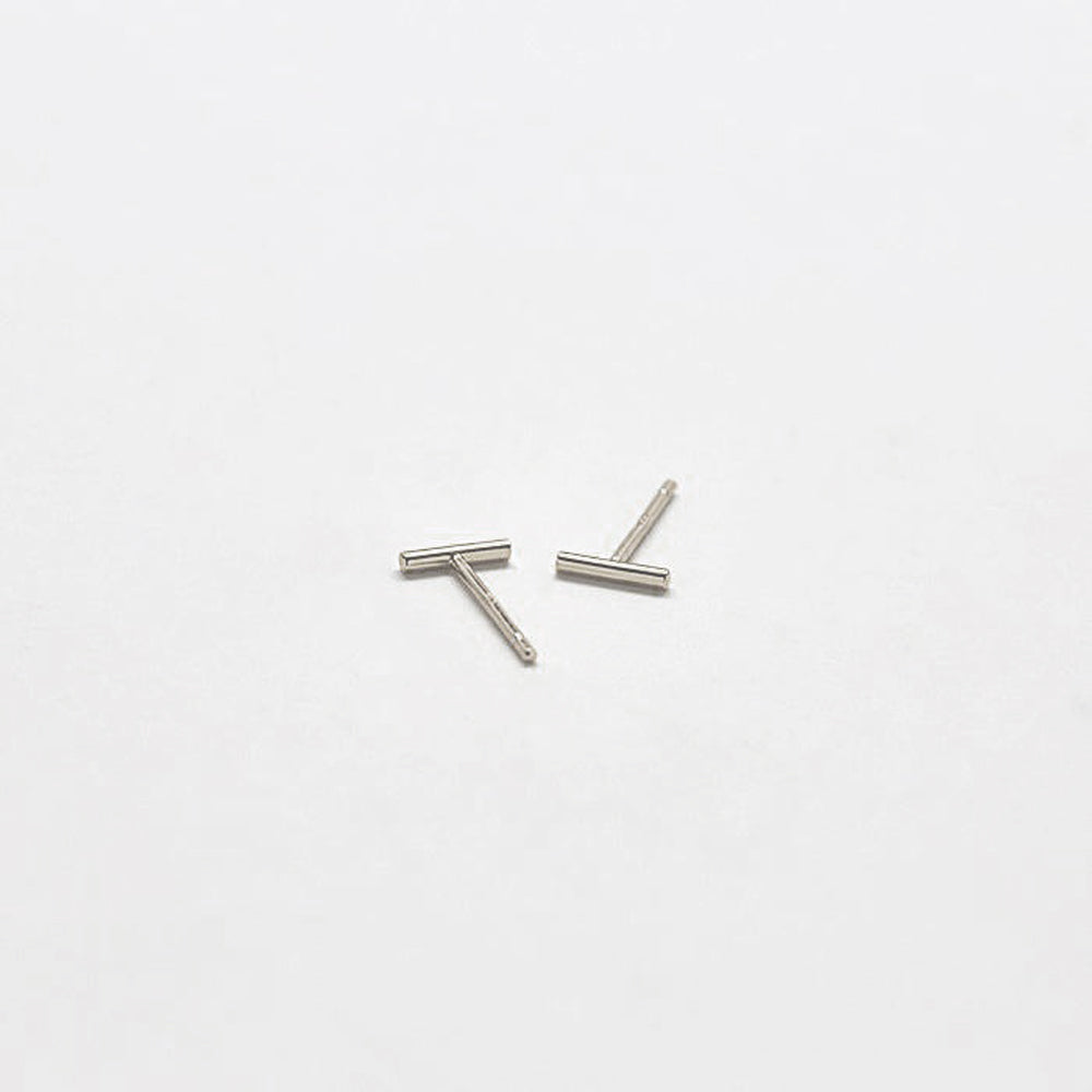 Two silver bar earrings on a white background