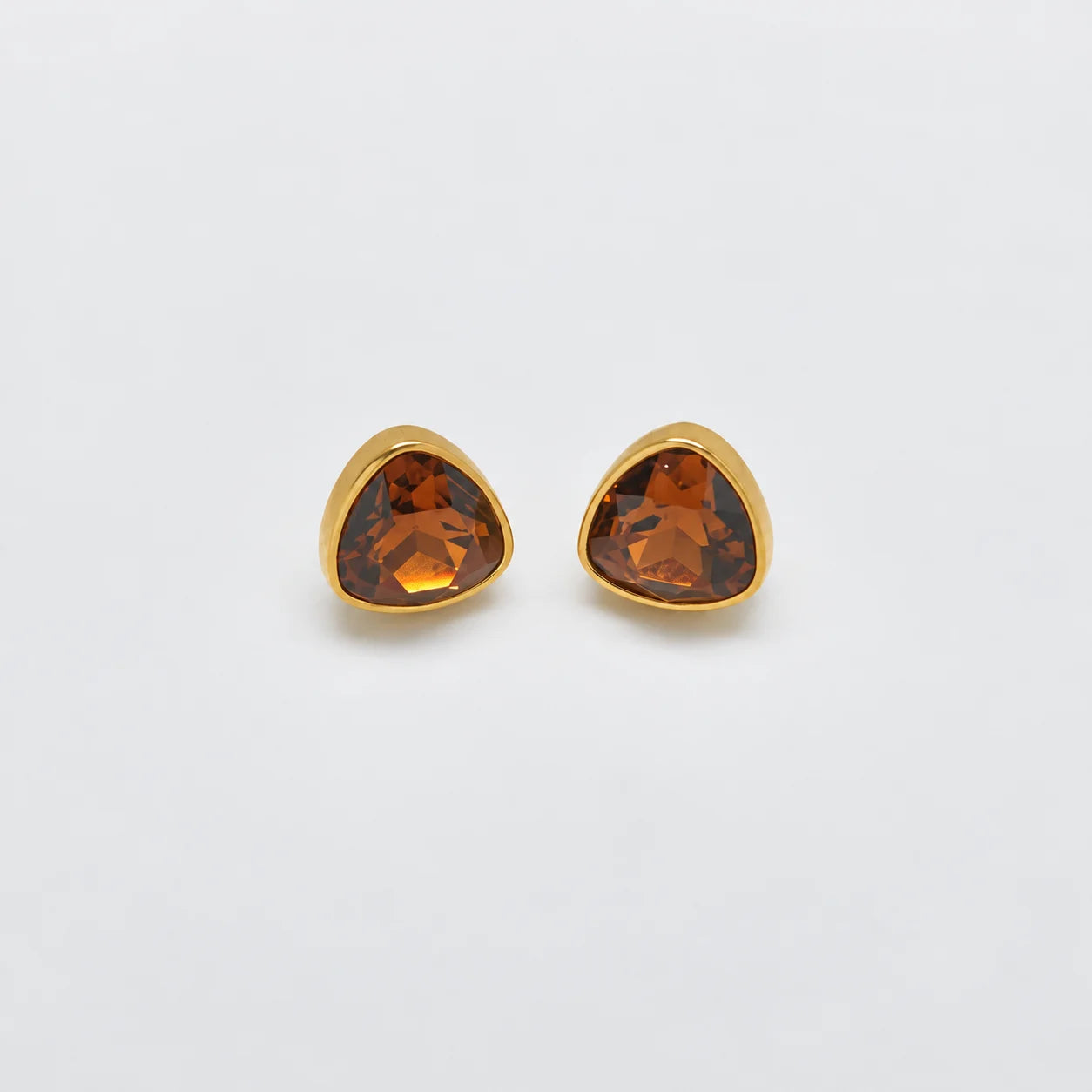 Vintage amber-tone triangular stud earrings — front