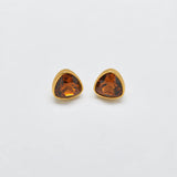 Vintage amber-tone triangular stud earrings — front