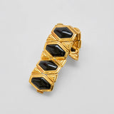 Vintage black geometric stretch bracelet — angled view