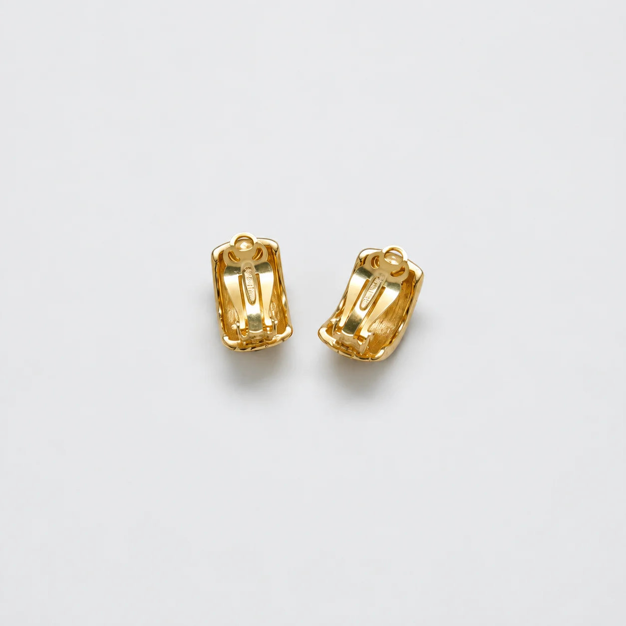 Vintage black-and-gold grid clip-on earrings — reverse and clips