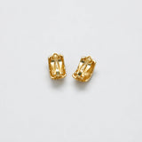 Vintage black-and-gold grid clip-on earrings — reverse and clips