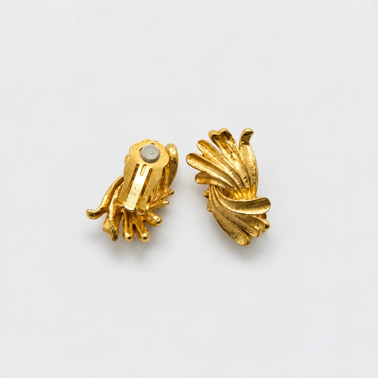 Vintage gold-tone fluted fan clip-on earrings — reverse and clip