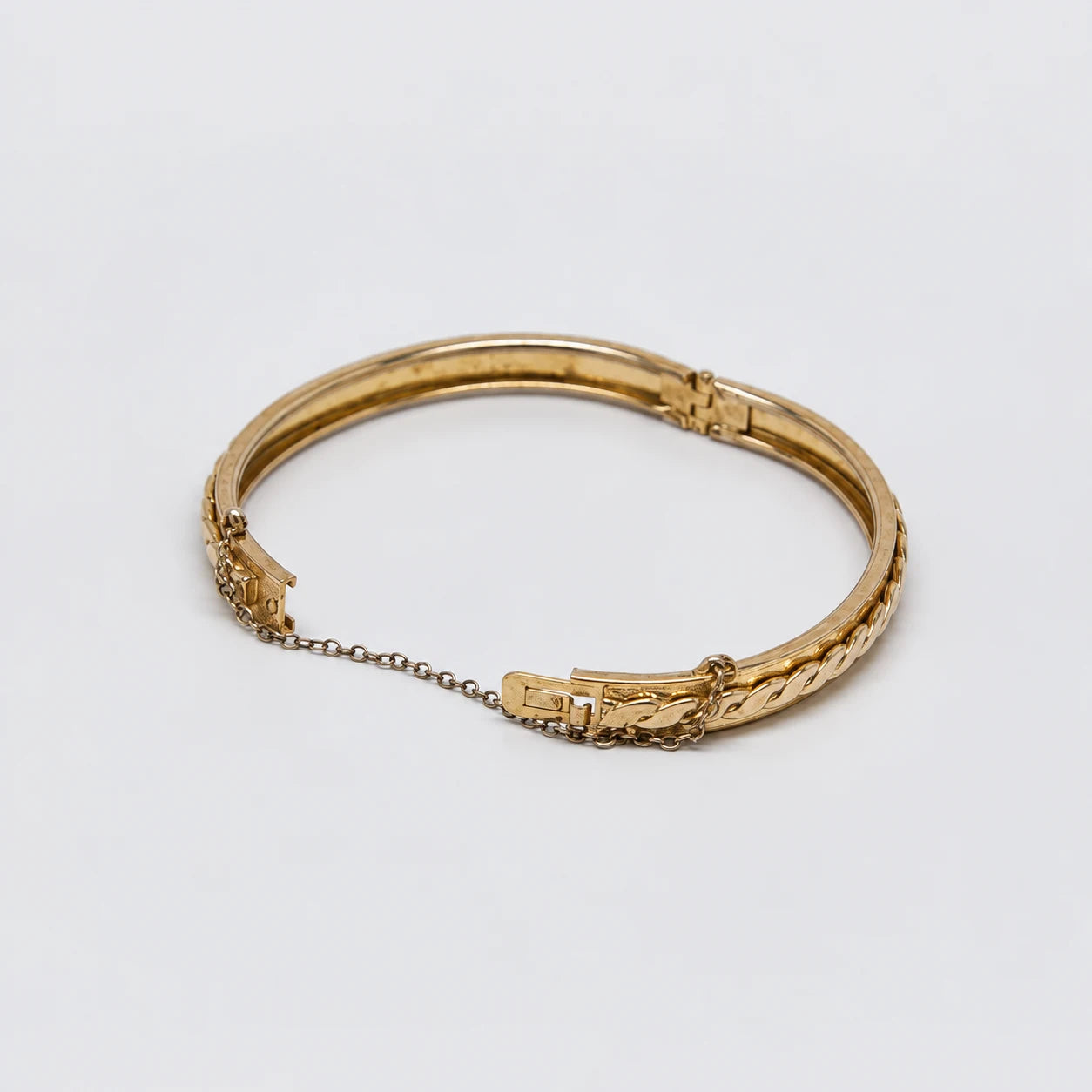 Vintage Gold-Tone Braided Hinged Bangle — open clasp and safety chain detail