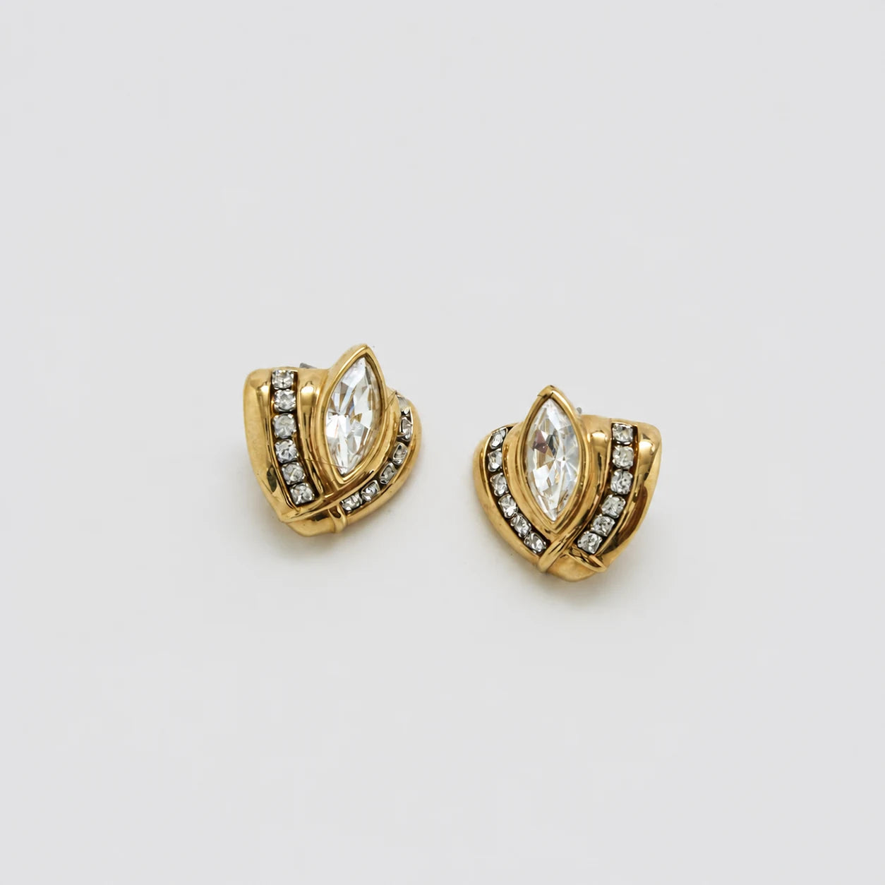 Vintage gold-tone crystal marquise earrings — angled view