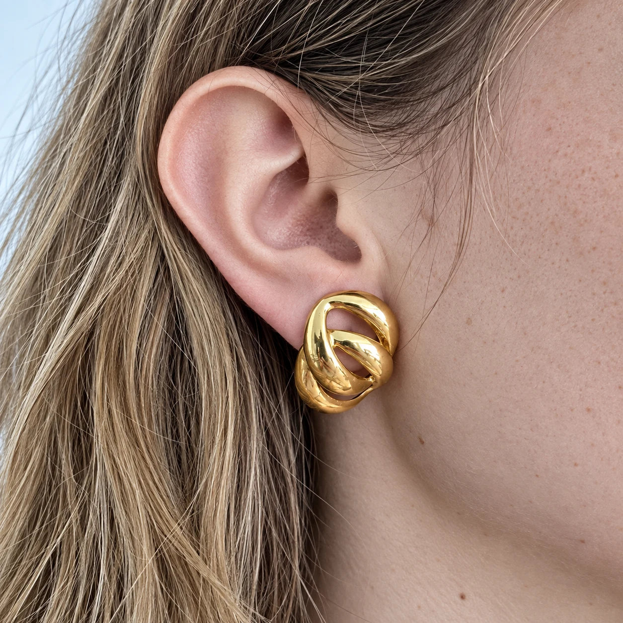 Vintage Gold-Tone Interlocking Loop Earrings — worn on model