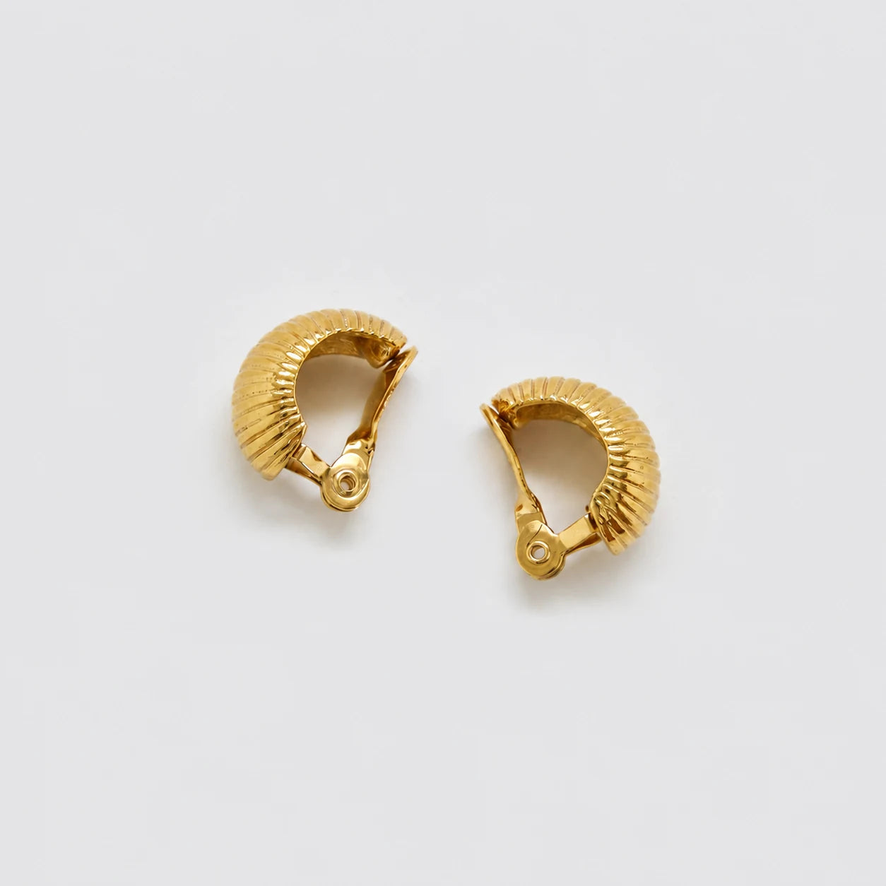 Vintage gold-tone ribbed crescent clip-on earrings — clip-back detail