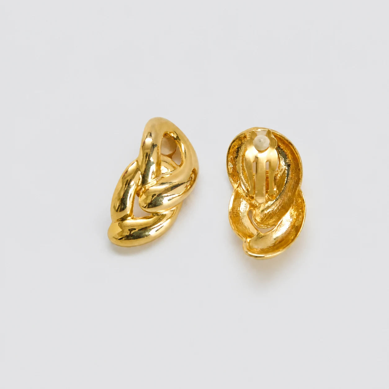 Vintage gold-tone sculptural knot clip-on earrings — front and clip backs