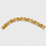 Vintage gold-tone sculptural knot link bracelet — reverse and clasp