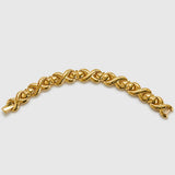 Vintage gold-tone sculptural knot link bracelet — front