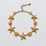 Vintage Gold-Tone Starfish and Spiral Disc Necklace — textured front and extender