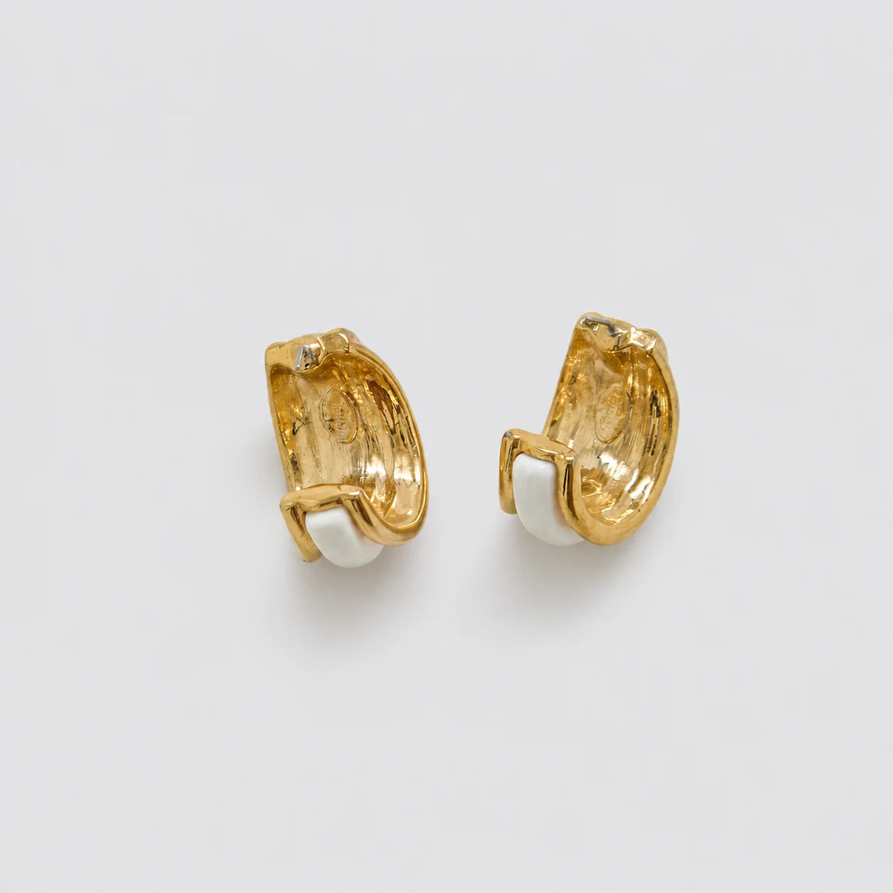 Vintage gold-tone white enamel hoop earrings — interior and reverse detail