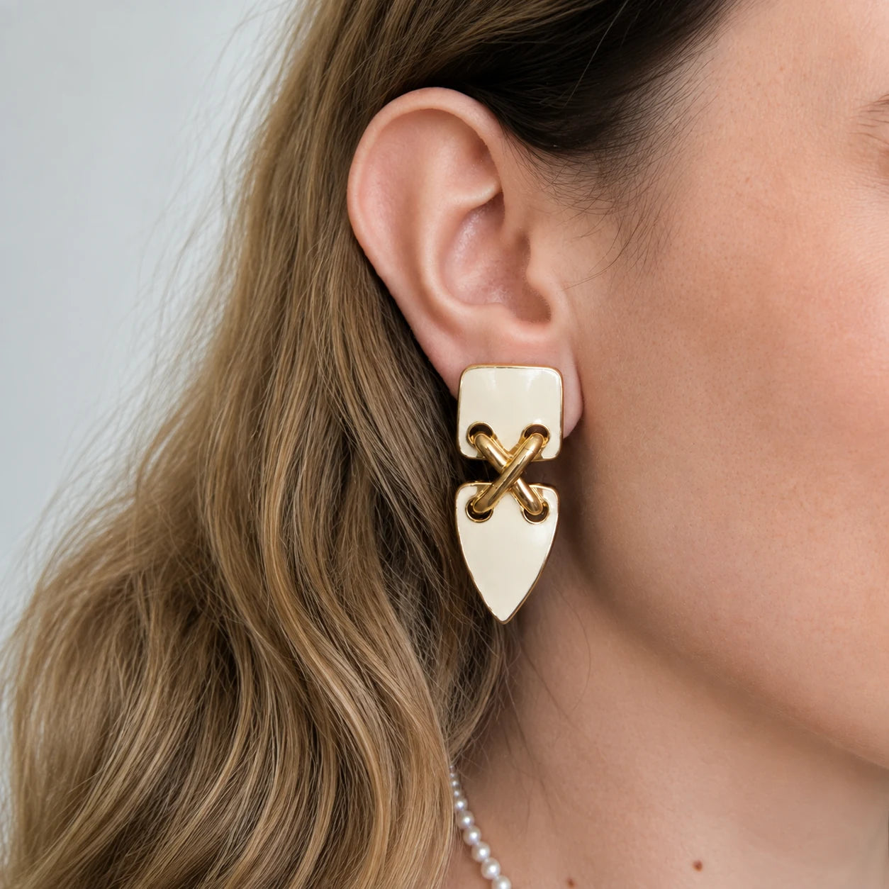 Vintage ivory geometric clip-on earrings worn on model