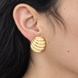 Vintage Napier ivory stripe shell earring — on-ear view