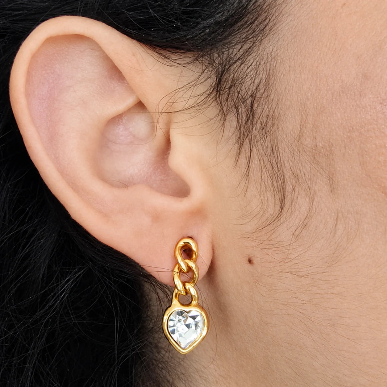 Vintage Monet crystal heart drop earrings — modeled