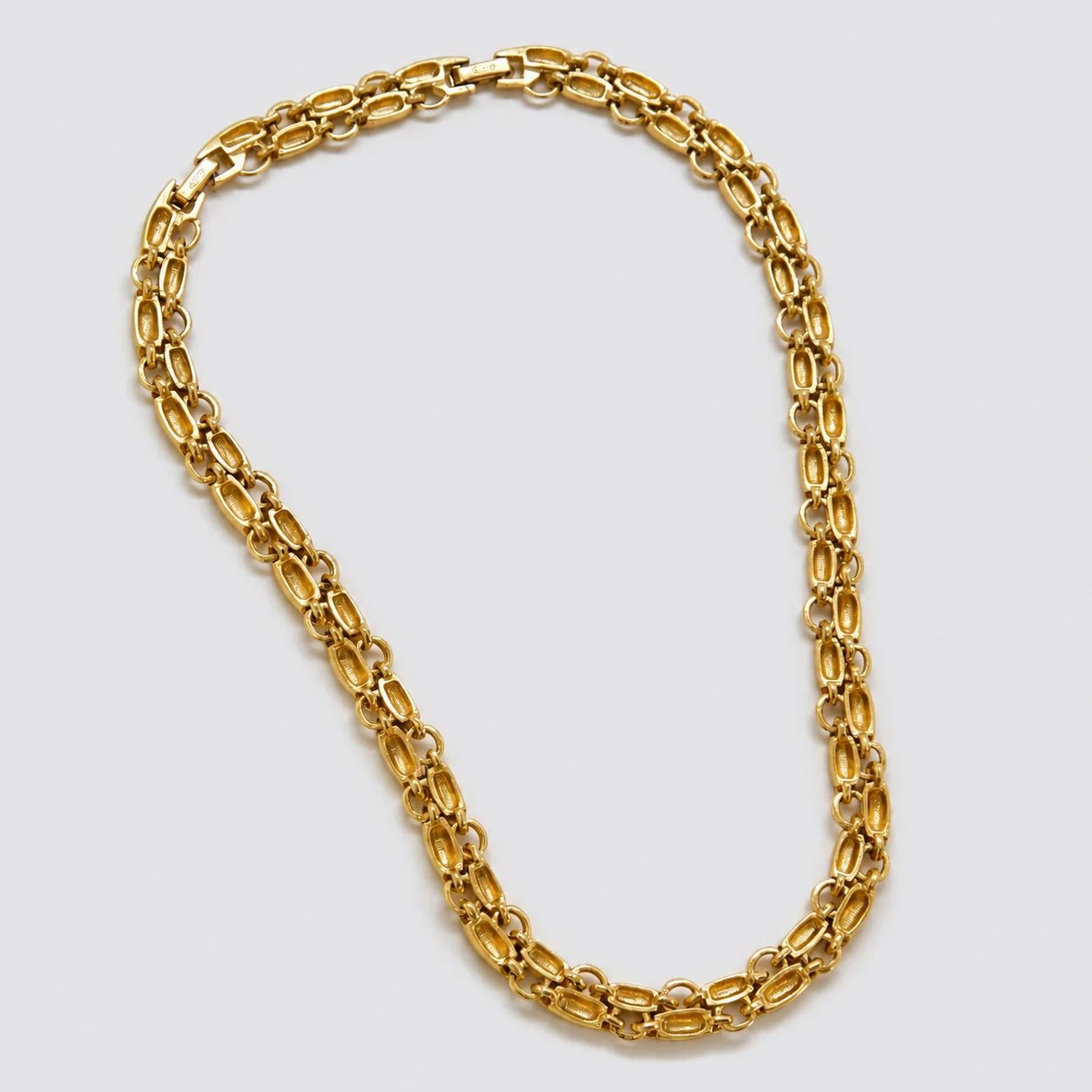 Vintage Monet gold-tone oval link necklace — reverse and signature