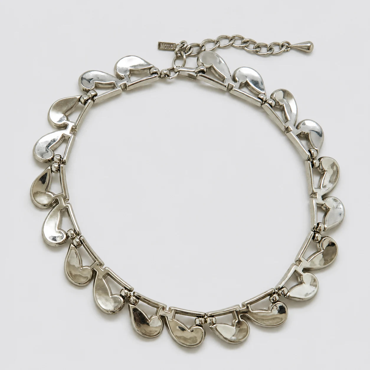 Vintage Monet silver-tone teardrop link necklace — reverse and signature