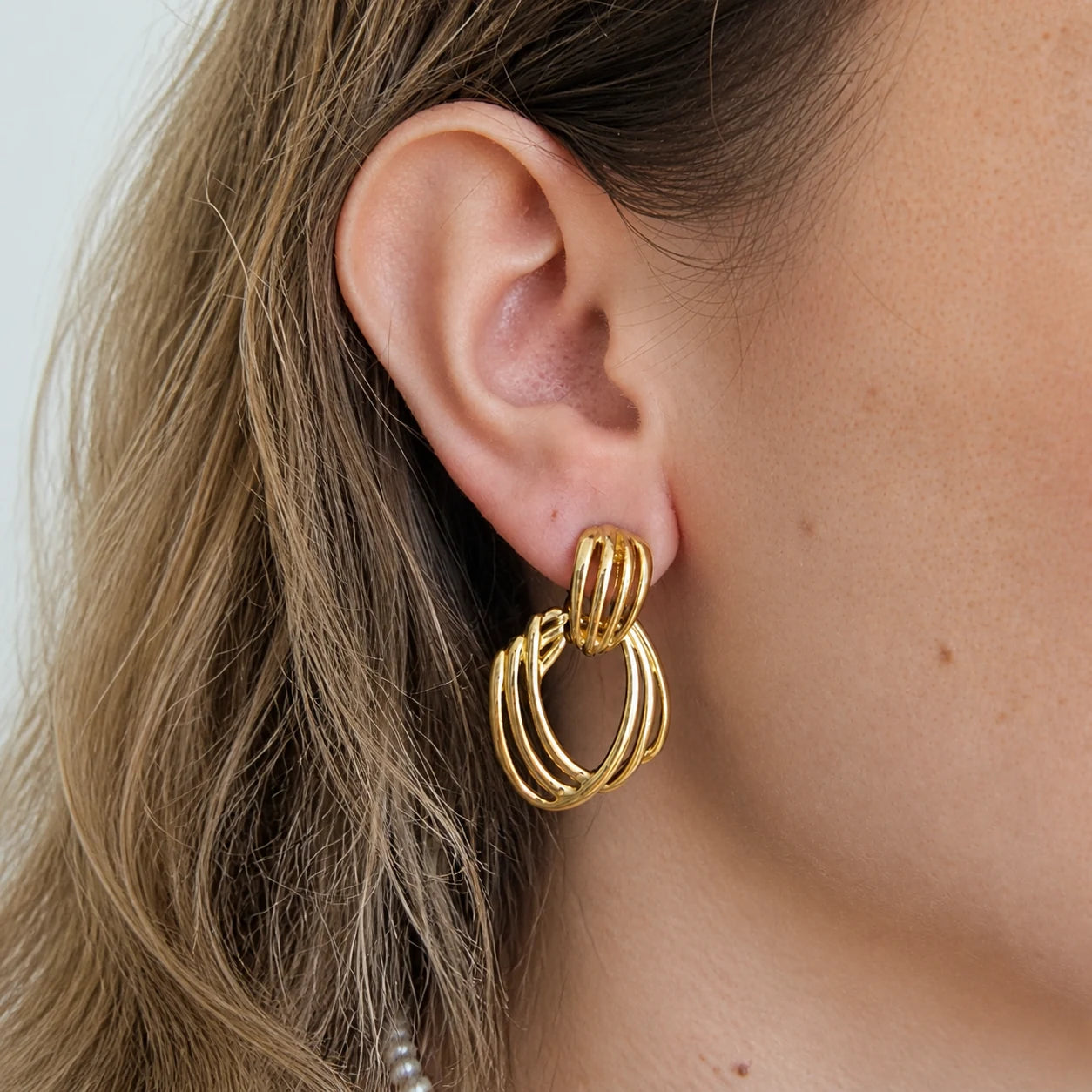 Vintage open wire drop earrings worn on model
