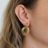 Vintage open wire drop earrings worn on model