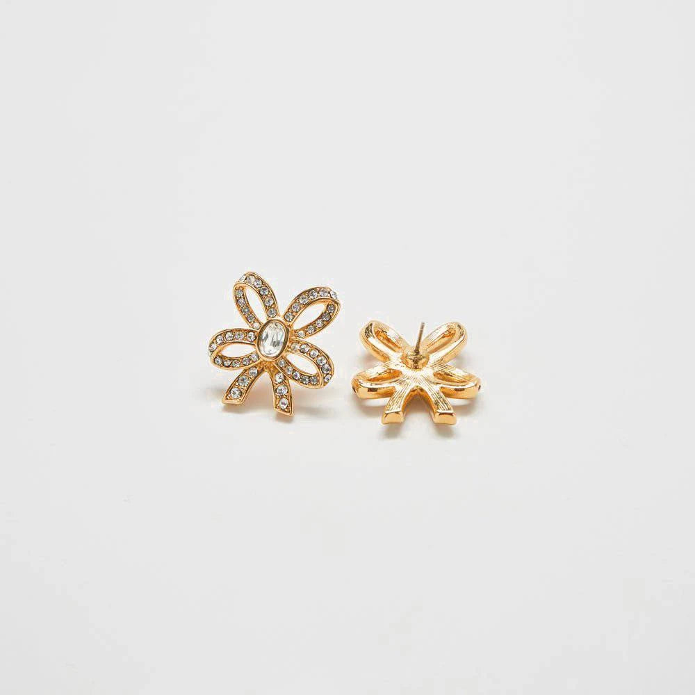 Front and back views of vintage pavé gold bow earrings on a light gray background