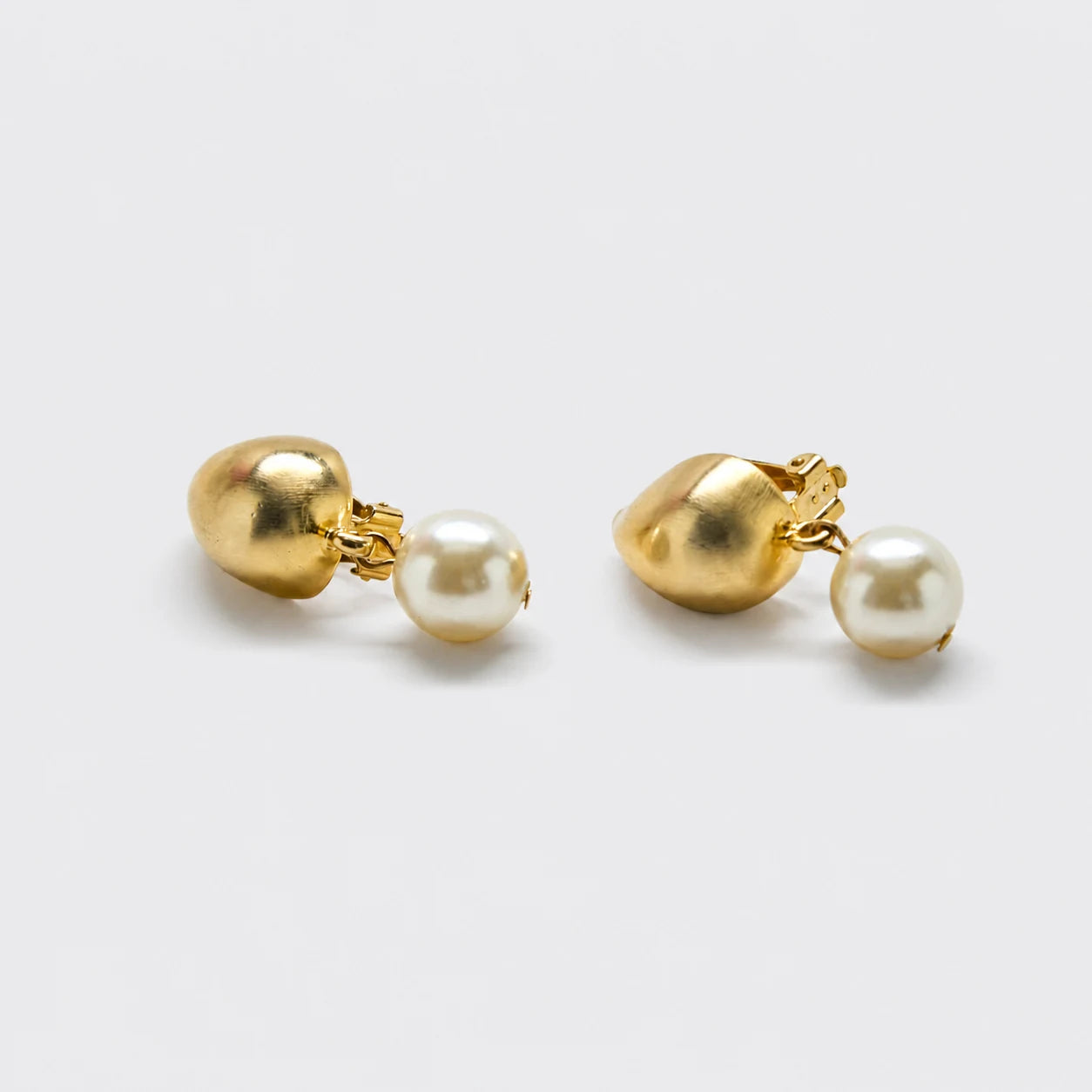 Vintage gold-tone pearl drop clip-on earrings — front