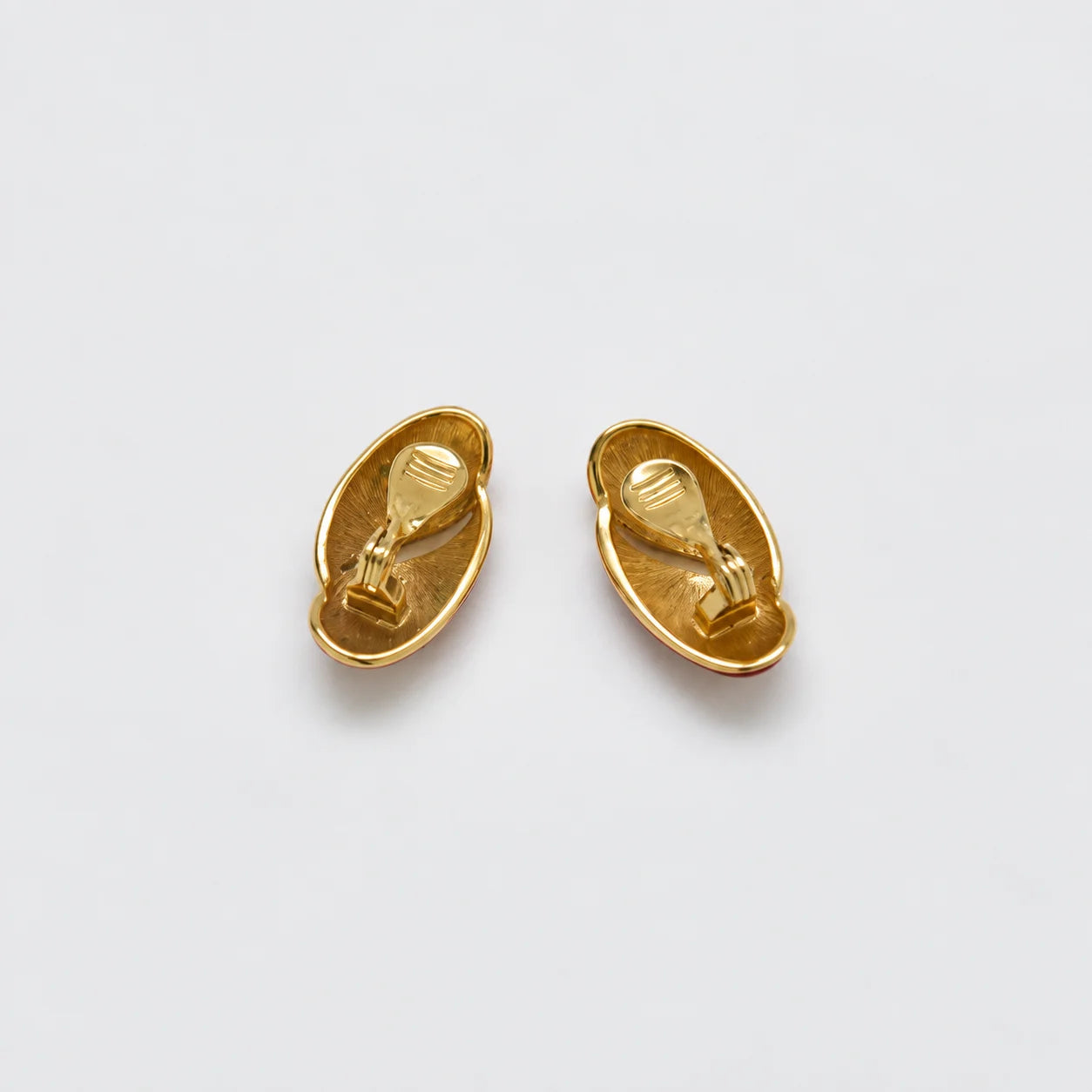Vintage red oval clip-on earrings — reverse and clips