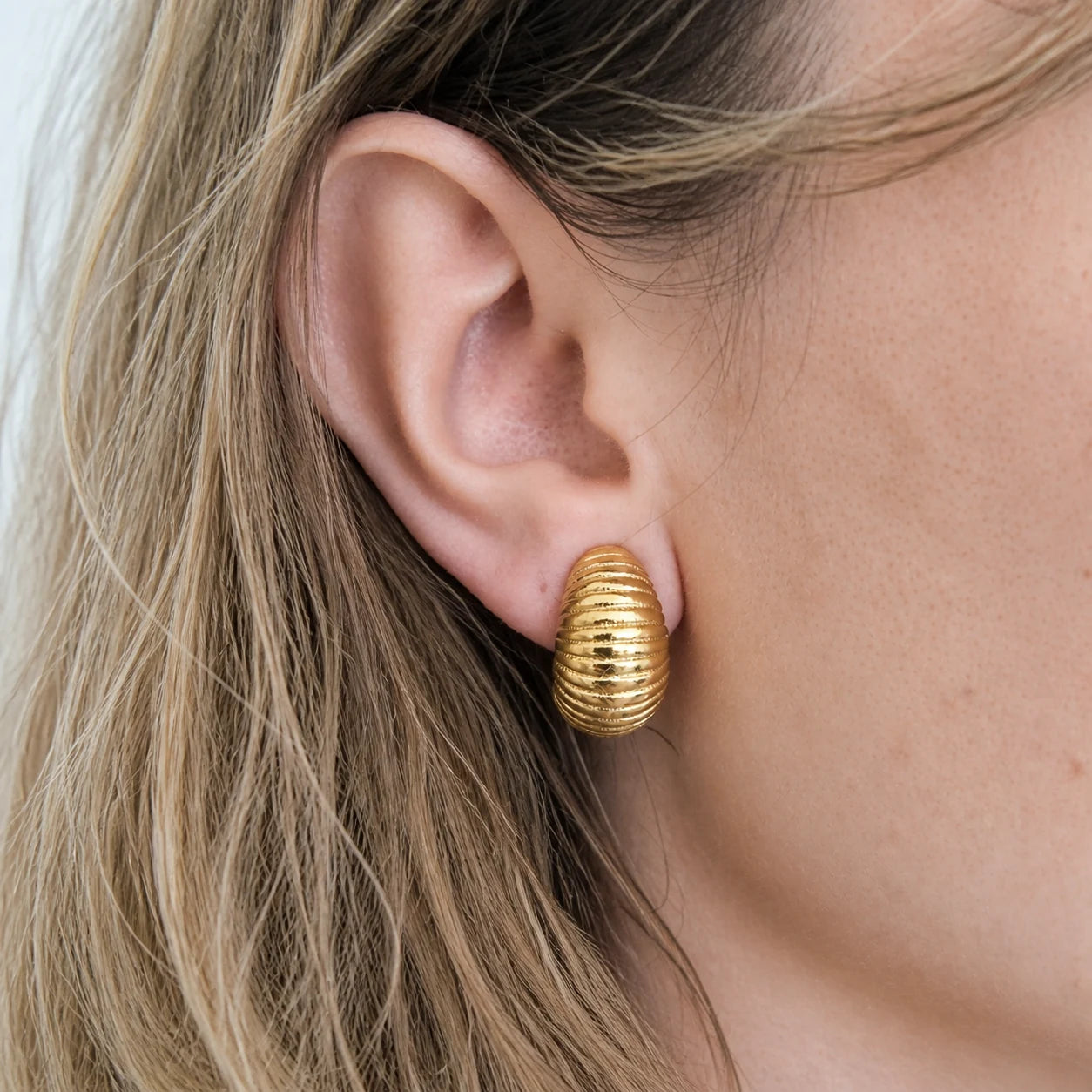 Vintage ribbed crescent clip-on earrings worn on model