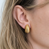 Vintage ribbed crescent clip-on earrings worn on model