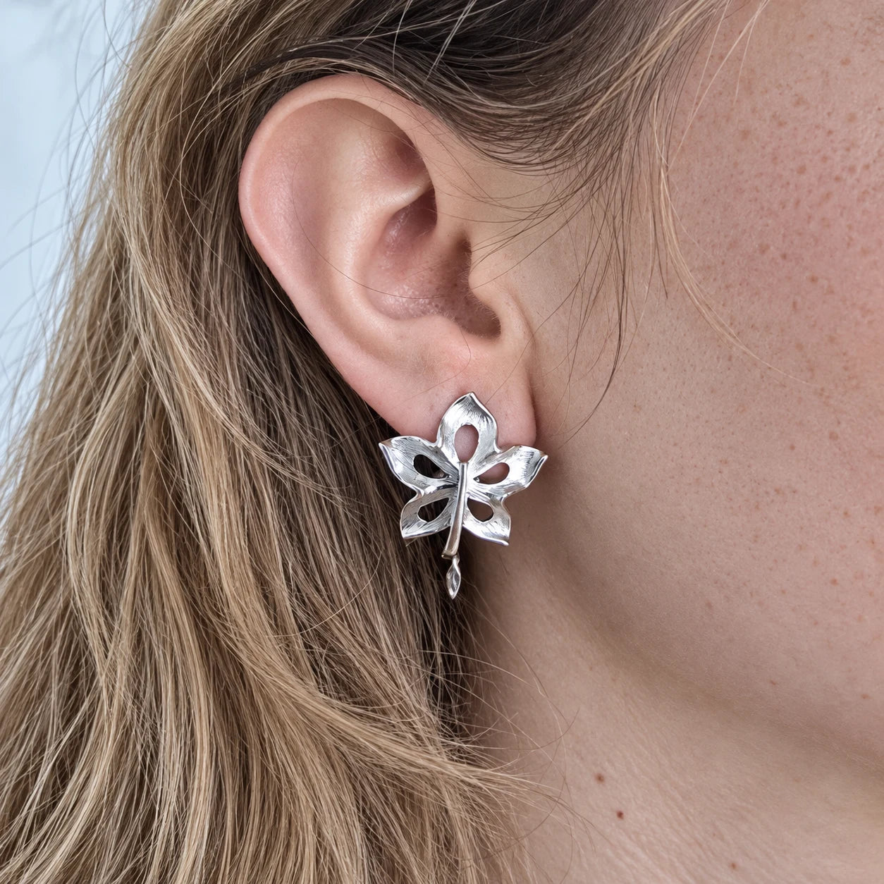 Vintage Silver-Tone Openwork Leaf Earrings — worn on model