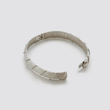 Vintage silver-tone textured hinged bangle — open clasp view
