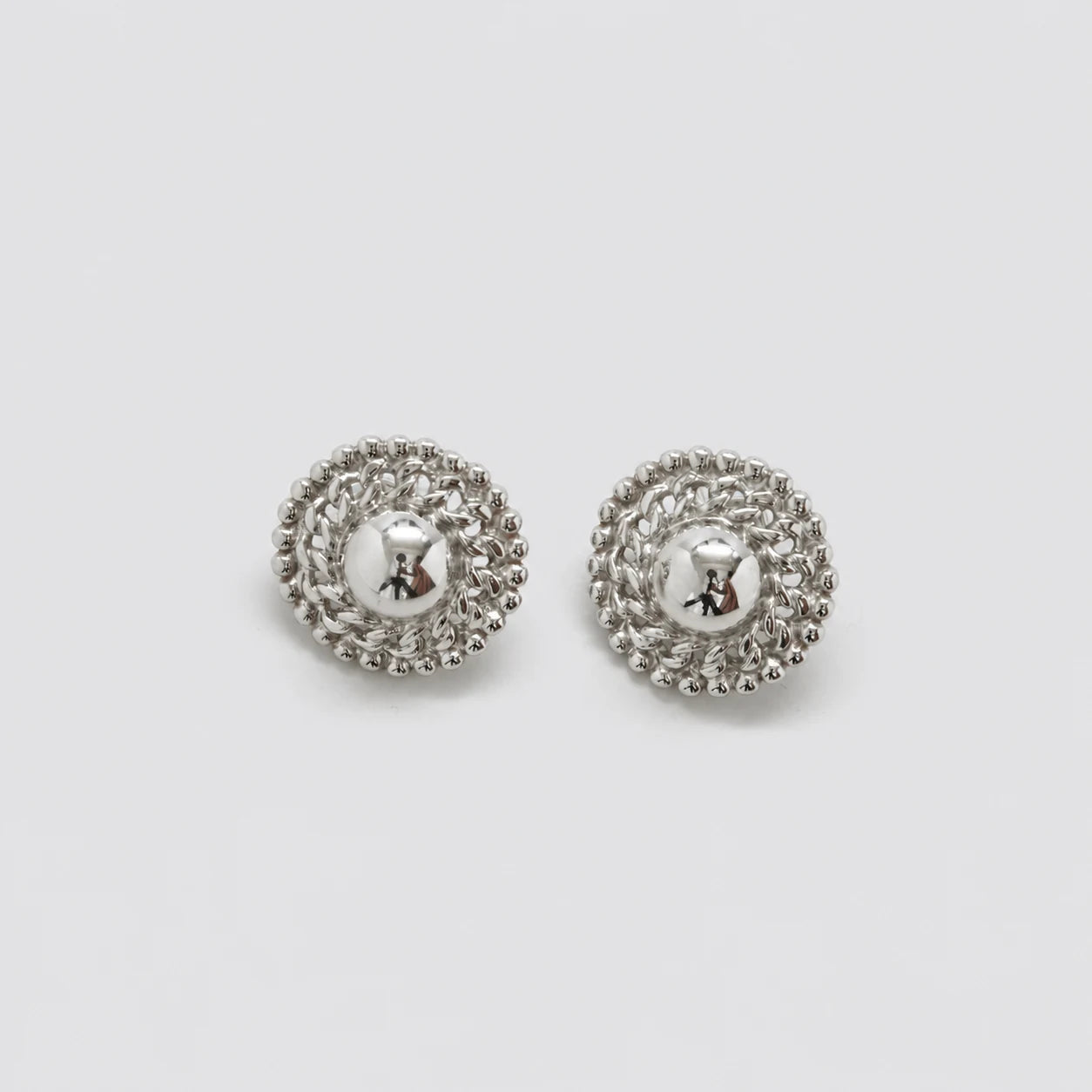 Vintage silver-tone woven dome earrings — front pair
